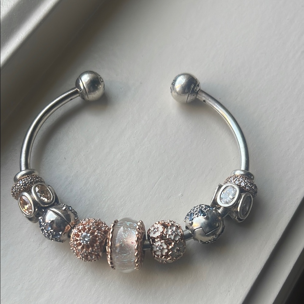 Pandora Silver and Gold Charm Bracelet with Pandora charms.